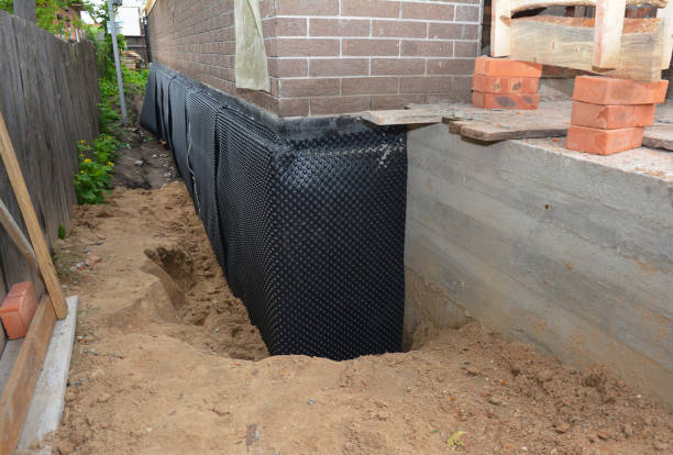 SJ Waterproofing Pros technician performing targeted Exterior Waterproofing assessment in Bellevue, WA